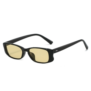 Vintage small frame black sunglasses with amber lenses and metallic rivets