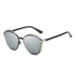 Chic cat-eye sunglasses with premium black and gold metal frame for women on white background