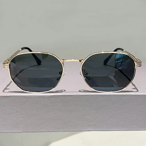 Detailed view of the gold metal frame and comfortable silicone nose pads of the sunglasses