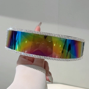 Close-up of rimless wrap-around sunglasses with gradient lenses and rhinestone trim