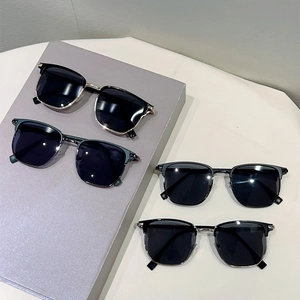 Retro half-rim metal sunglasses in various colors displayed on a modern minimalist surface