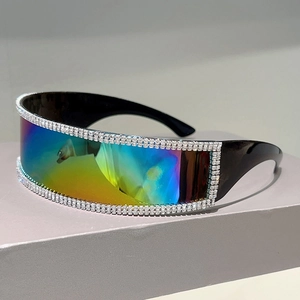 Close-up of iridescent rimless oversized sunglasses with rhinestone-studded frame edges