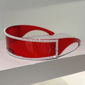 Detail view of red rimless shield sunglasses with sparkling double-row rhinestone accents