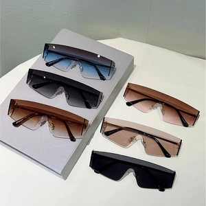 Lunettes de soleil Y2K futuristes sans monture avec verres dégradés et supports en métal doré