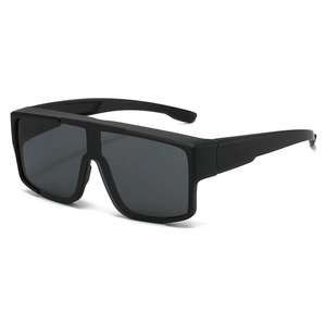 Detail of matte black cycling sunglasses showing frame front and secure nose pads