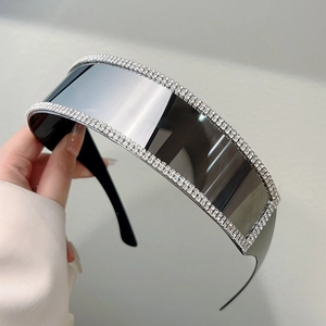 Frameless oversized futuristic sunglasses with luxury rhinestone trim and mirrored lenses