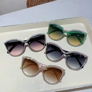 Cat eye oversized sunglasses with rhinestone edges and gradient lenses for women