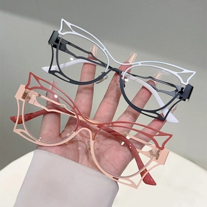 Close-up of butterfly cut-out cat-eye frames with bicolor hollow geometric metal design