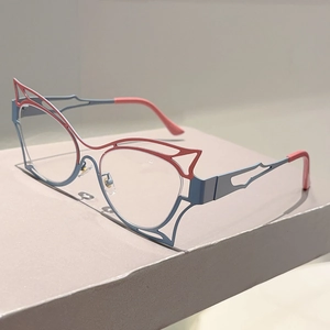 Detailed side view of cutout butterfly cat-eye frames in light blue and coral pink