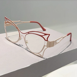 Macro side view of hollow-out butterfly cat-eye frames in rose gold and wine red
