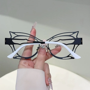 Fashionable butterfly hollow cutout frames in black and white two-tone contrast style