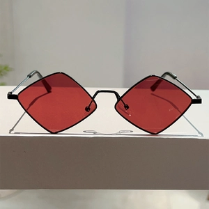 Detail of retro small frame sunglasses with red diamond lenses and thin metal frame