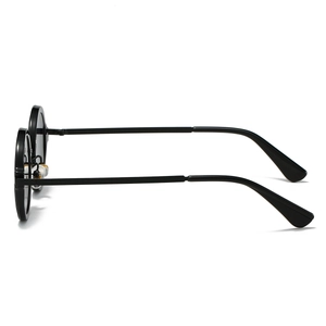 Retro round steampunk sunglasses in black with yellow nose pads and slim temples