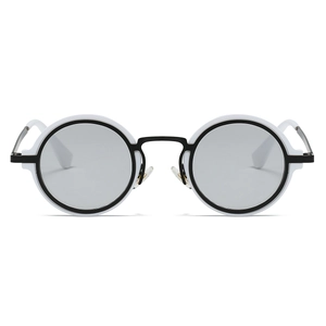 Detail of round frame sunglasses with black and white two-tone frame and grey lenses