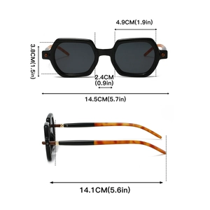 Detail showing geometric black frame sunglasses with tortoiseshell temples and dimensions