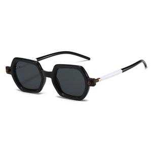 Detail of square sunglasses with black resin frame and unique black-white spliced temples