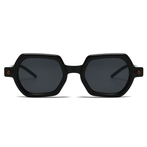 Detail view of black hexagonal sunglasses featuring polished frames and dark lenses