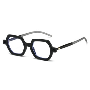 Detail of square black frame glasses with grey temples and gold metal accents