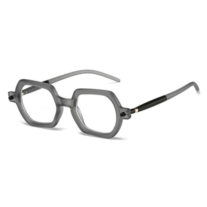 Detailed side view of grey translucent hexagonal frame glasses with golden hinge accents