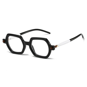 Detail of square black glasses frame with bicolored temples and brown bead accent