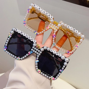 Detail of Birthday Girl party sunglasses with pearls and colorful candy decorations