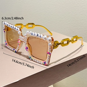 Detail view of square birthday girl sunglasses with white pearls and gold chain arms