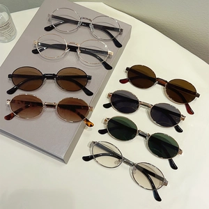 Retro metal round frame sunglasses and clear lens glasses collection on display