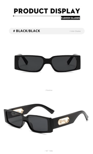 Detail of square sunglasses featuring golden leopard side ornaments on black frames