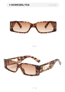 Detail of tortoiseshell square sunglasses featuring golden leopard motif on the temples