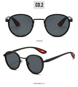Detail of round metal sunglasses with dark lenses and red non-slip temple tips