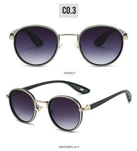 Close-up of round metal frame sunglasses with purple gradient lenses and gold bridge