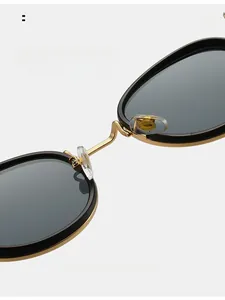 Detailed close-up of comfortable transparent nose pads on metallic round sunglasses