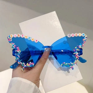 Butterfly shaped birthday sunglasses with blue lenses and Birthday Queen bead decoration