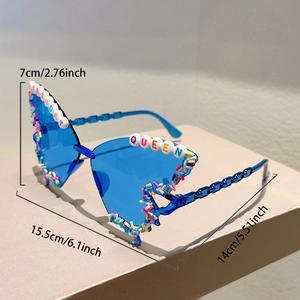 Detailed view of blue party sunglasses with Birthday Queen letters and colorful sprinkles