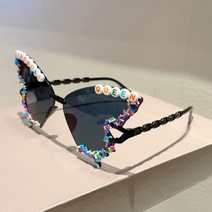 Detail of party sunglasses featuring Birthday Queen letter beads and colorful sugar accents