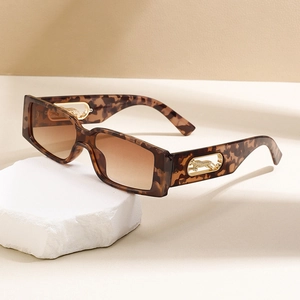 Retro square leopard print sunglasses with gold cheetah metal detail on white stone