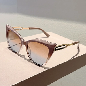Detailed macro view of gradient lenses and hollow metal temples on cat-eye sunglasses