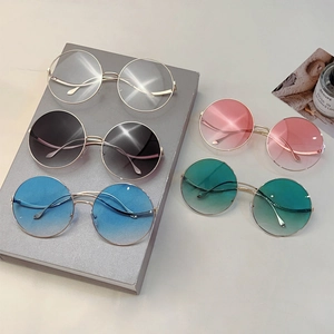 Classic round metal sunglasses in five gradient colors displayed on a white background