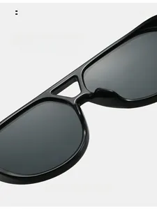 Detail of comfortable integrated nose pads on thick black frame oversized sunglasses