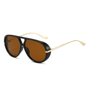 Vintage oversized aviator sunglasses with black frame and golden metal temples