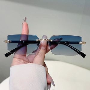 Fashionable rimless rectangle sunglasses with blue gradient lenses and gold metal hardware