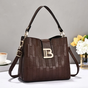 Deep brown embossed leather handbag for women featuring a gold B logo clasp and dual straps