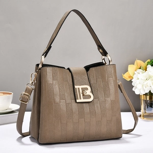 Brown checkered embossed leather tote bag with gold B-buckle and adjustable shoulder strap