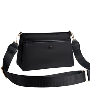 Classic black nylon crossbody bag with adjustable strap and gold hardware in front view