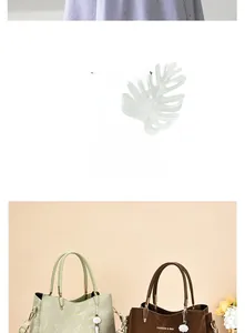 Detail of stone textured leather handbags in green and brown with floral charms