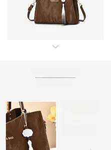 Detail of dark brown leather handbag with vintage crinkled texture and lotus tassel
