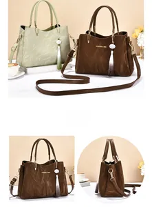 Detail of soft pleated texture bag with pearl tassel and gold hardware accents