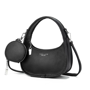 Elegant black crescent shoulder bag in pebble leather with a small round coin purse