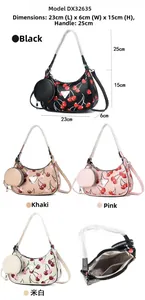 Detail view of cherry print crescent underarm bag with matching round coin pouch set