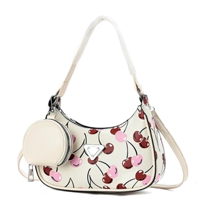 White hobo shoulder bag with cherry print and matching round coin purse charm